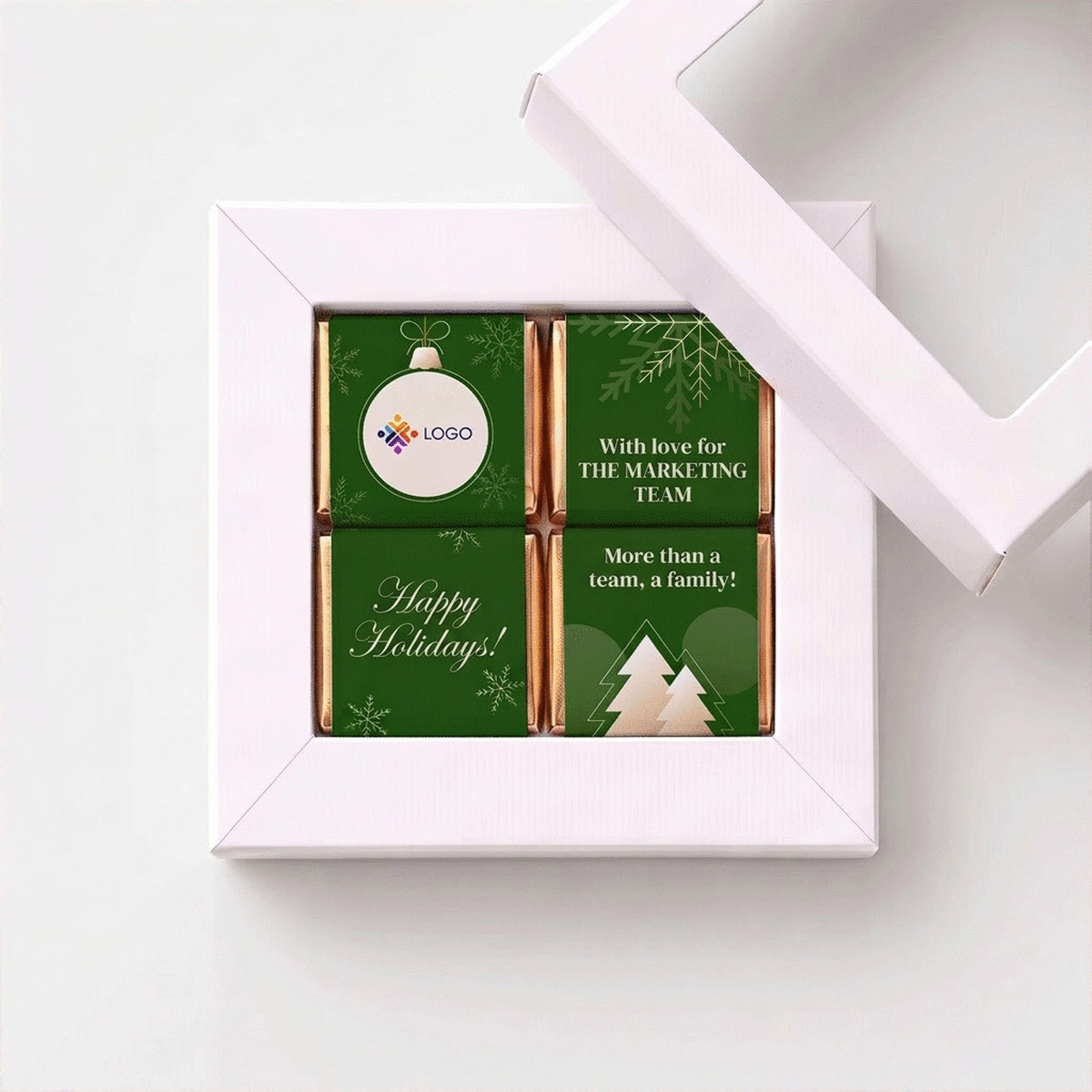 Geschenkdoos met 4 mini-chocoladehapjes, gepersonaliseerd met logo en boodschap voor het team